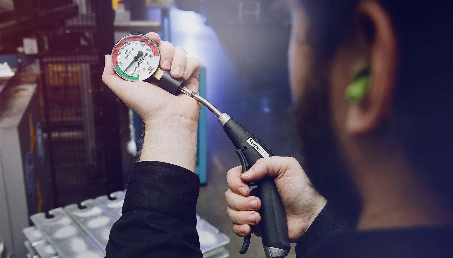 Man-with-Pro-One-airgun-OSHA-gauge